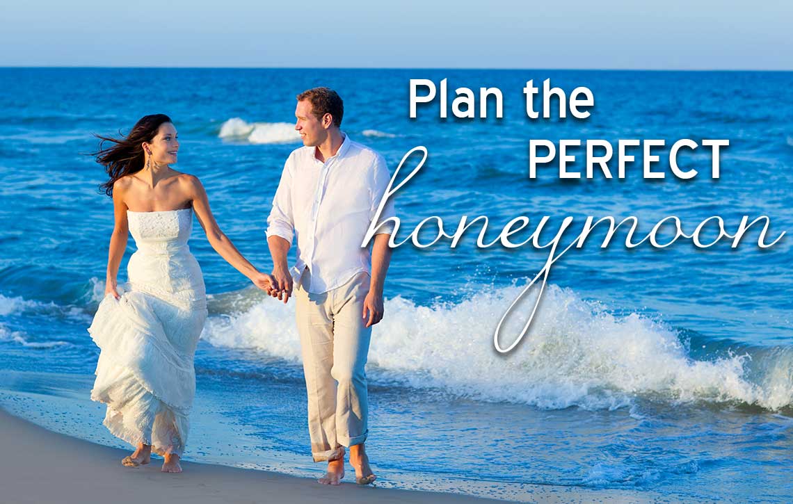 plan honeymoon couple walking on beach